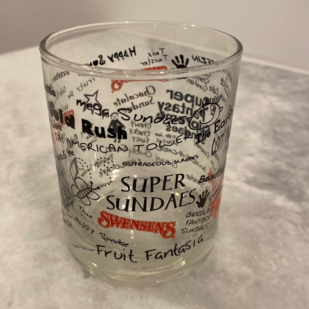 Glass cup with Swensen's logo.